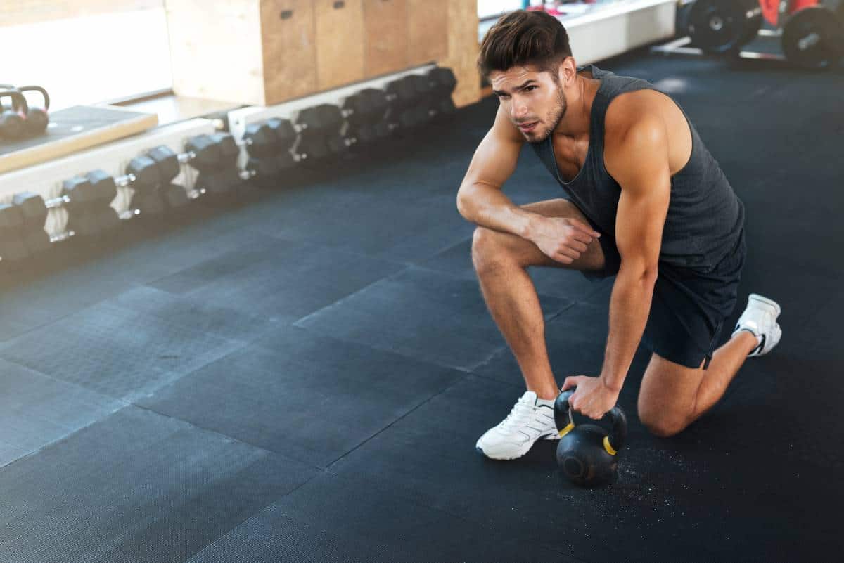 man with 35 pound kettlebells 